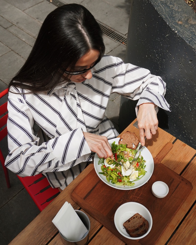 Melon salad being shared outdoors