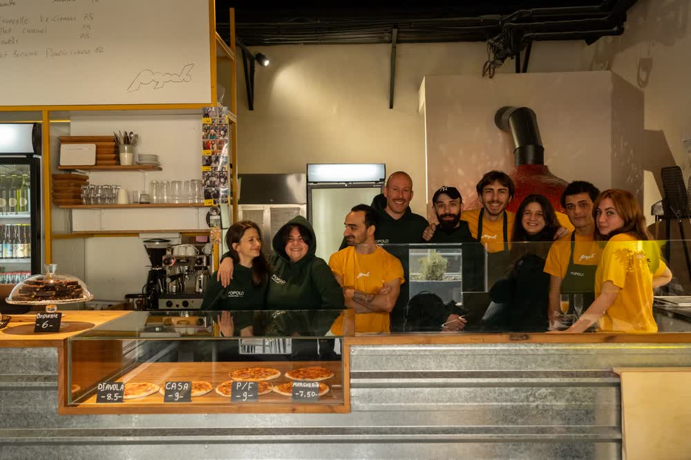 The Popolo team together behind the counter